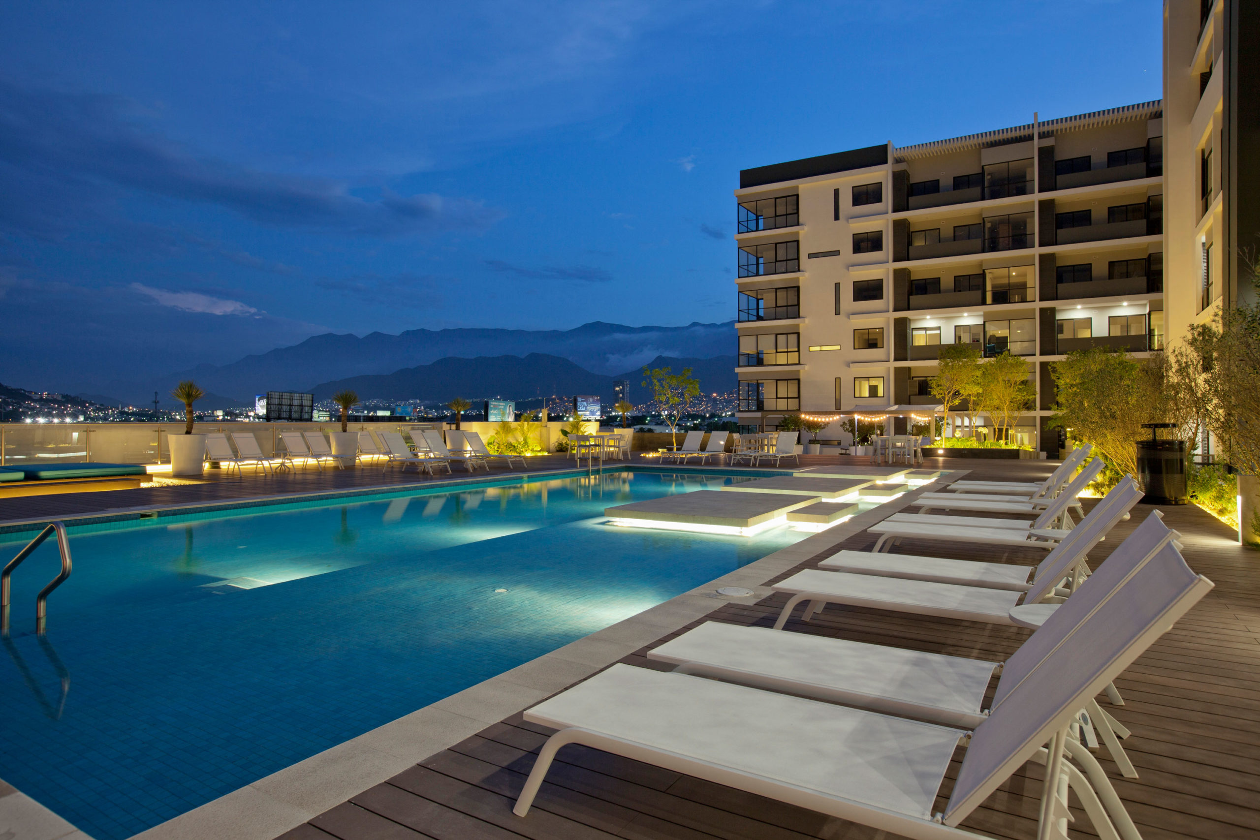 poolside nightscape rendering gran ciudad luxury apartment homes